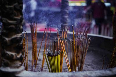 Close-up of incense sticks at temple 