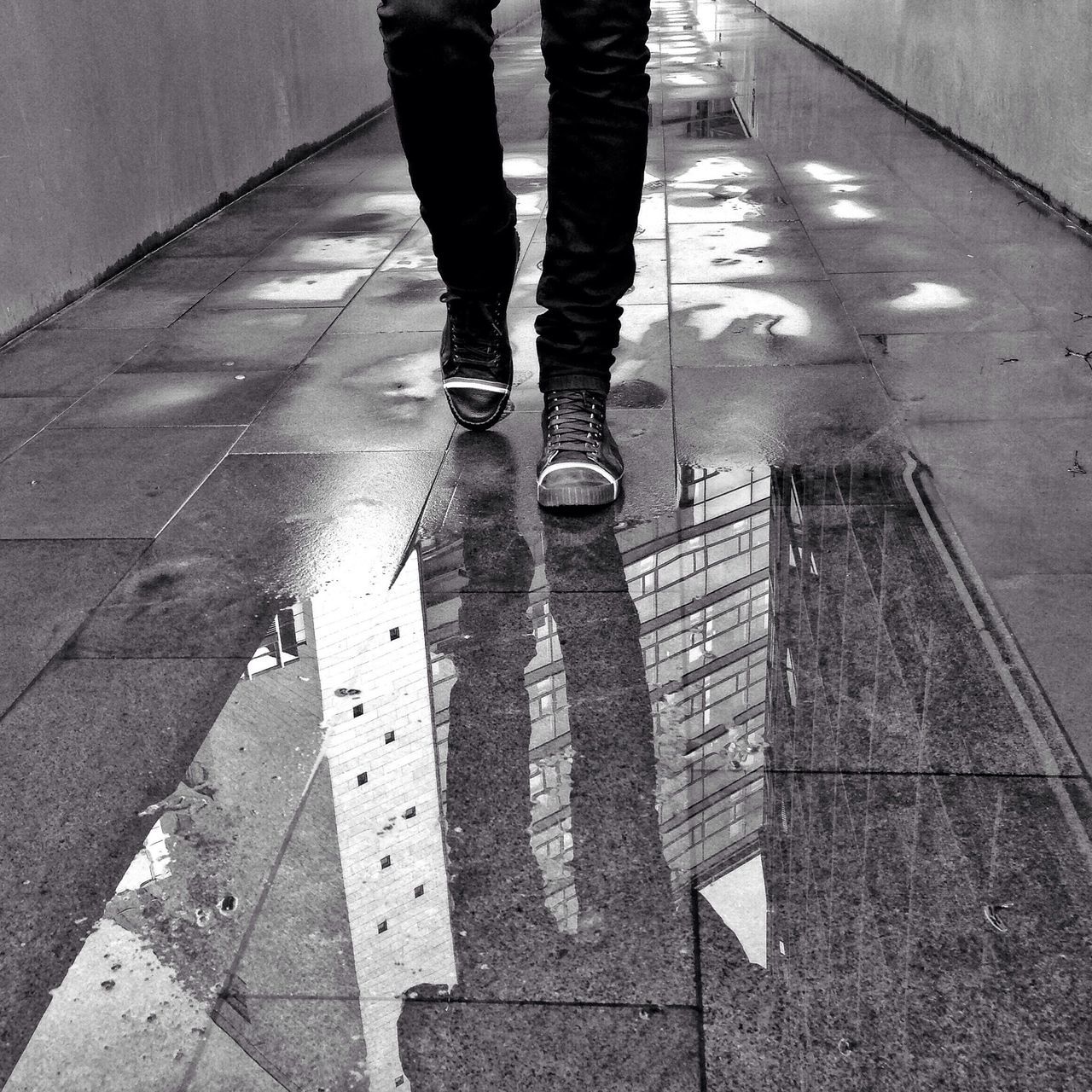 low section, person, lifestyles, men, walking, standing, leisure activity, unrecognizable person, street, high angle view, shoe, reflection, tiled floor, shadow, human foot, indoors