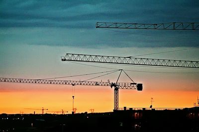 Low angle view of built structure against sky at sunset