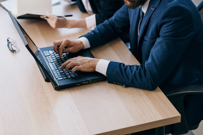 People using laptop on table