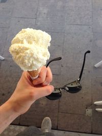 Cropped image of person holding spoon