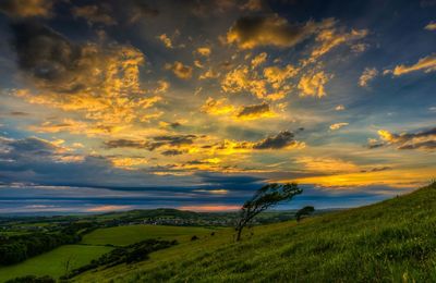 Scenic view of dramatic sky over landscape