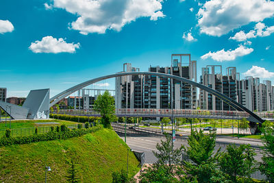 View of bridge and buildings against sky