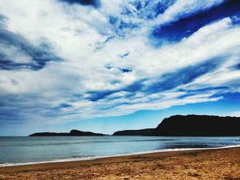 Scenic view of sea against cloudy sky