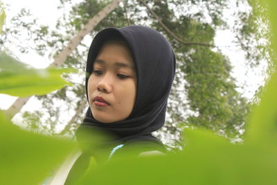 Portrait of young woman looking away