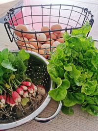 High angle view of vegetables in basket on table