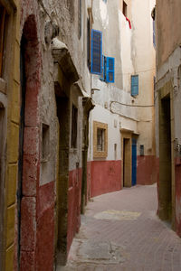 Narrow alley amidst buildings in city