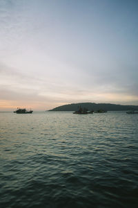 Scenic view of sea against sky at sunset
