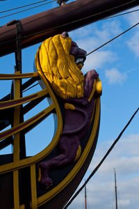 Low angle view of statue against sky