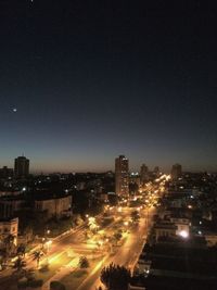 Illuminated cityscape at night