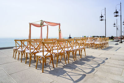 Lifeguard chair on beach against clear sky