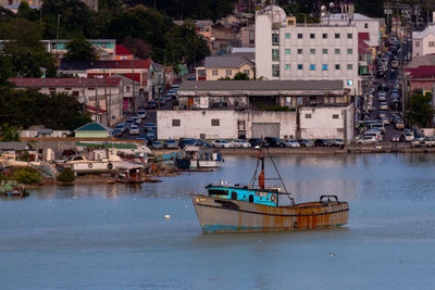 High angle view of harbor by buildings in city