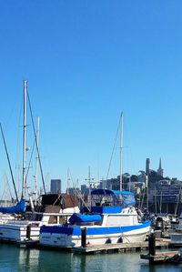 Boats moored at harbor