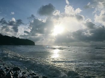 Scenic view of sea against cloudy sky