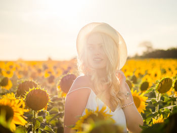 Young woman on sunflower field