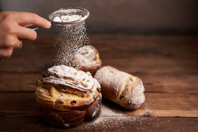 Close-up of person preparing food on table