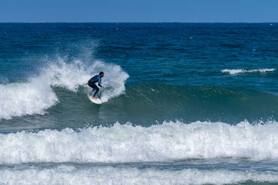 Man surfing in sea