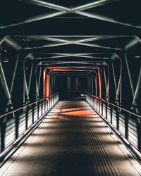 Empty covered bridge at night