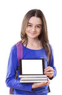 Portrait of smiling young woman using phone against white background