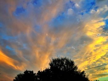 Low angle view of cloudy sky at sunset