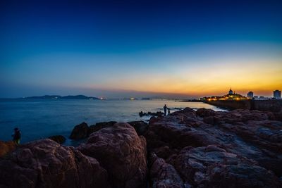 Rocks at sea during dusk