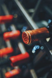 Close-up of bottles in rack