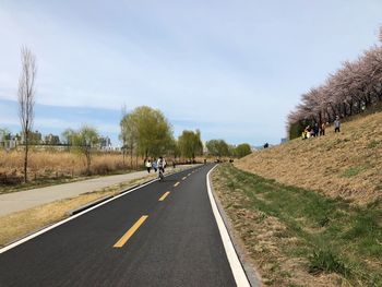 People on road against sky