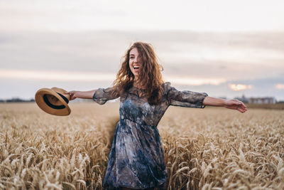 Full length of woman standing on field