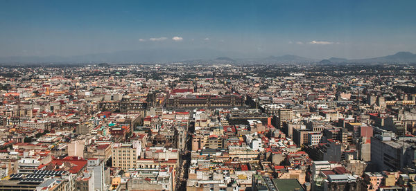 High angle view of illuminated cityscape against sky