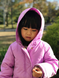 Cute girl wearing hoodie outdoors