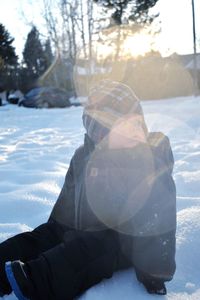 Man on snow covered land