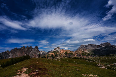 Tourist with backpack in mountains, dolomites south tyrol