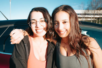 Portrait of young woman in car