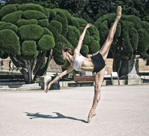 Amazing ballerina pose outdoors dancing, lifestyle concept.