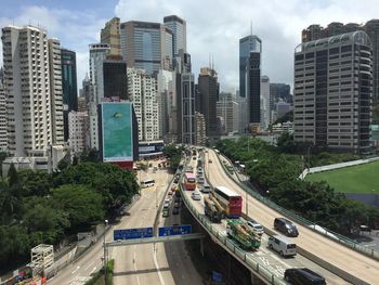Traffic on elevated road against skyscrapers in city