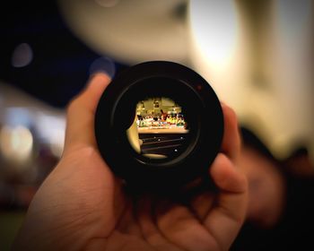 Close-up of man holding camera