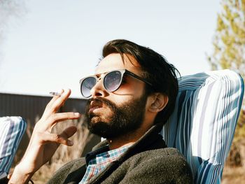 Portrait of young man wearing sunglasses