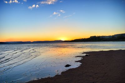 View of beach at sunset