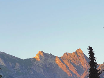 Scenic view of rocky mountains against clear sky