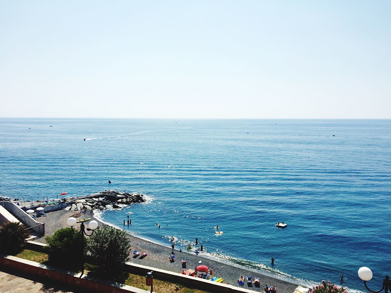 sea, horizon over water, water, clear sky, copy space, beach, scenics, blue, tranquil scene, high angle view, tranquility, beauty in nature, nature, shore, seascape, incidental people, vacations, day, outdoors, ocean