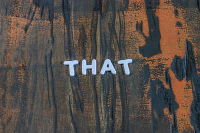 Close-up of text on wood