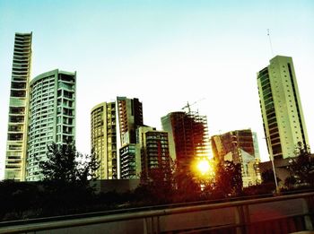 Low angle view of modern buildings against clear sky