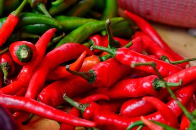 Close-up of red chili peppers on table