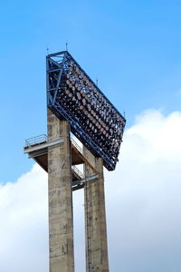 Low angle view of floodlight against sky