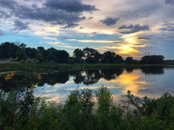 Scenic view of lake against sky during sunset