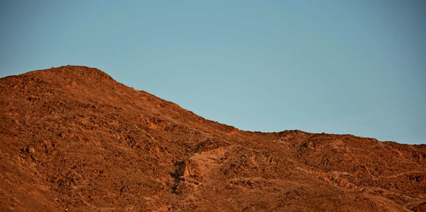 Low angle view of mountain against clear sky