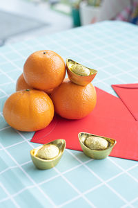 Close-up of oranges on table