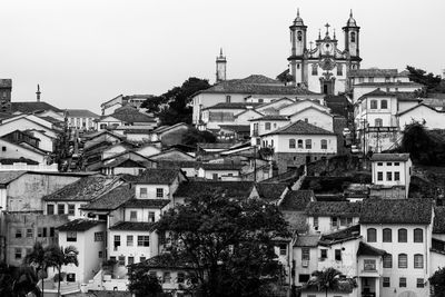 Church with townscape against sky