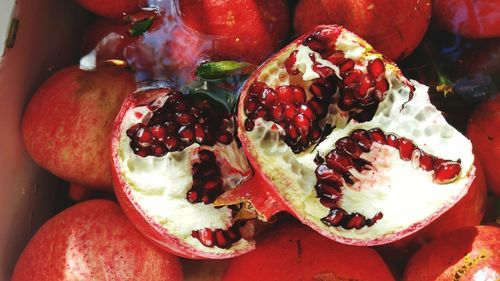 Close-up of pomegranates in container for sale at market