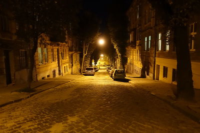 Cars on street in city at night